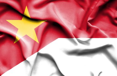 Waving flag of Monaco and Vietnam