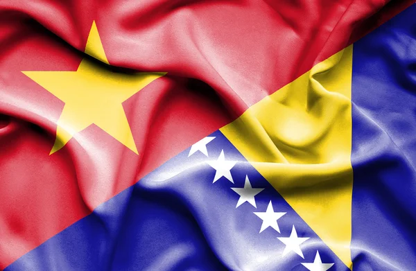 Waving flag of Bosnia and Herzegovina and Vietnam — Stockfoto
