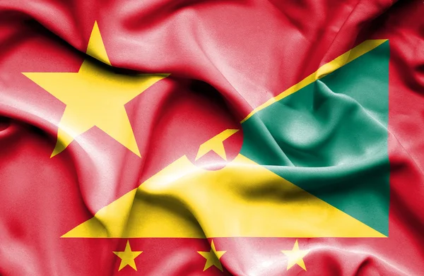 Flagge von Guernsey und Vietnam schwenkend — Stockfoto