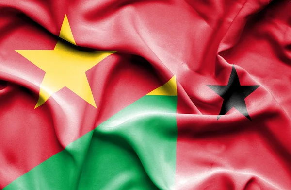 Waving flag of Guinea Bissau and Vietnam — Stock Photo, Image