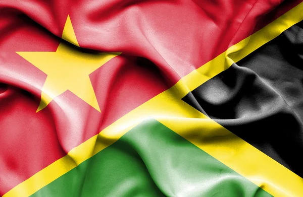 牙买加和越南那飘扬的旗帜 — 图库照片