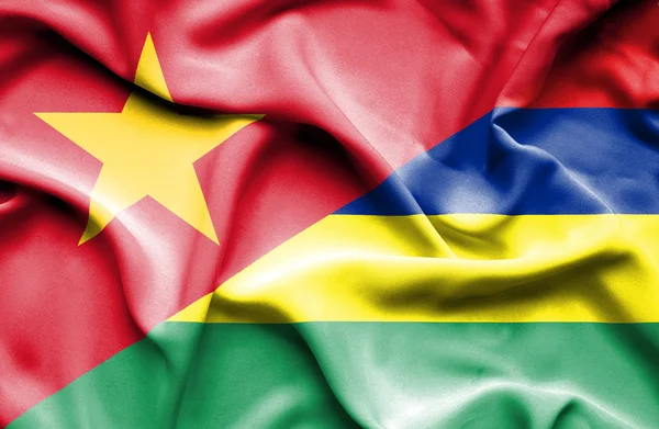 Flagge von Mauritius und Vietnam schwenkend — Stockfoto
