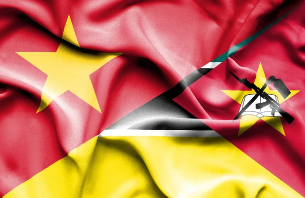 Waving flag of Mozambique and Vietnam — Stok fotoğraf