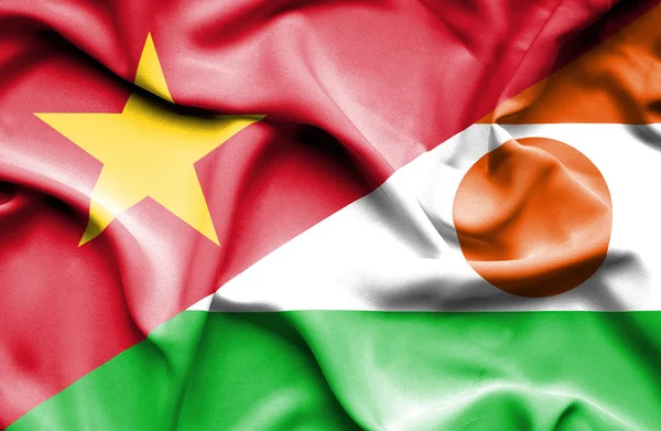 Waving flag of Niger and Vietnam — ストック写真