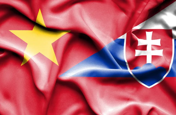 Waving flag of Slovakia and Vietnam — ストック写真
