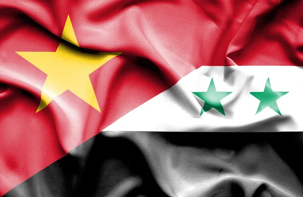 Waving flag of Syria and Vietnam — Stockfoto