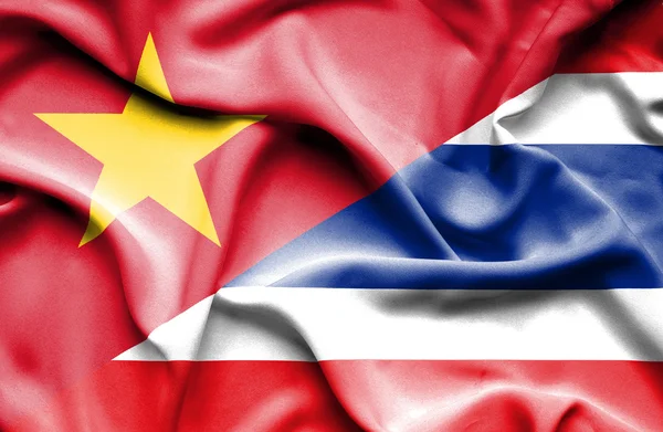 Waving flag of Thailand and Vietnam — Stockfoto