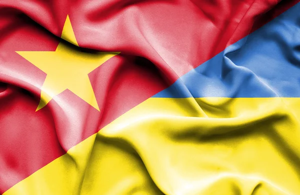 Waving flag of Ukraine and Vietnam — Stok fotoğraf