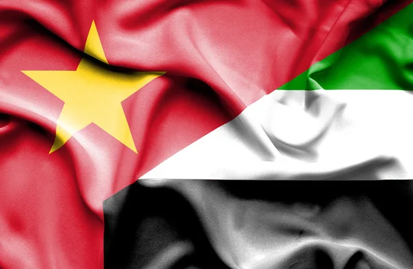 Waving flag of United Arab Emirates and Vietnam — Stok fotoğraf