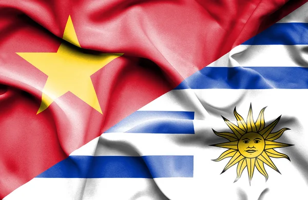 Waving flag of Uruguay and Vietnam — Φωτογραφία Αρχείου