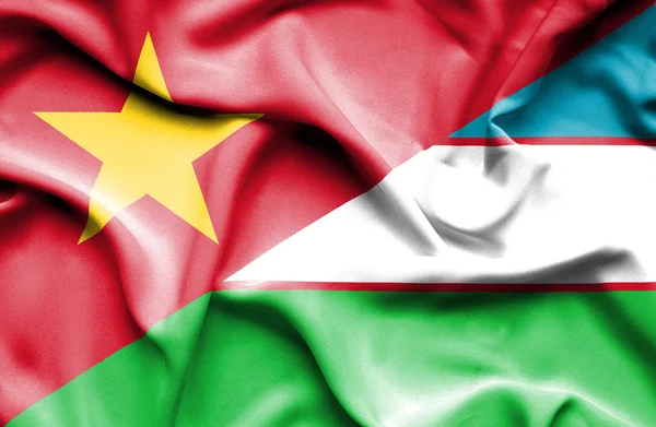 Waving flag of Uzbekistan and Vietnam — 图库照片
