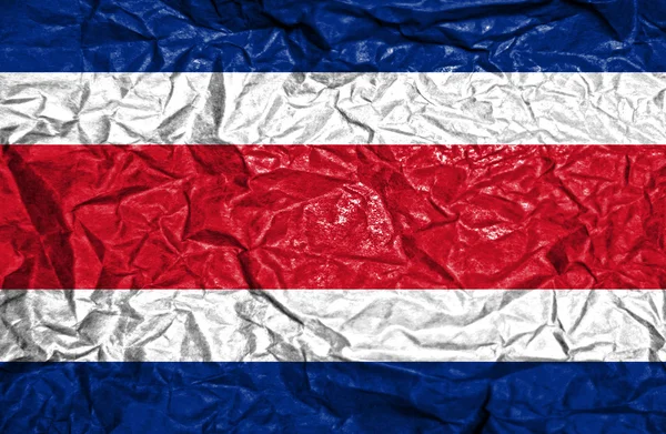 Bandera de Costa Rica sobre fondo de papel viejo arrugado — Foto de Stock
