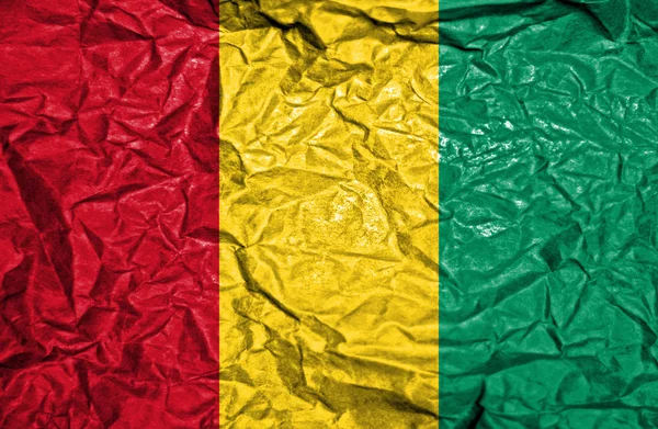 Vintage flaga Gwinei na stary tło zmięty papier — Zdjęcie stockowe