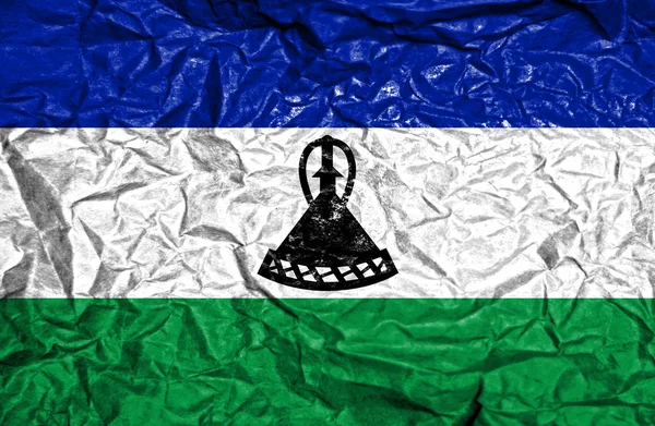 Lesotho vintage bayrağı eski buruşuk kağıt arka plan üzerinde — Stok fotoğraf