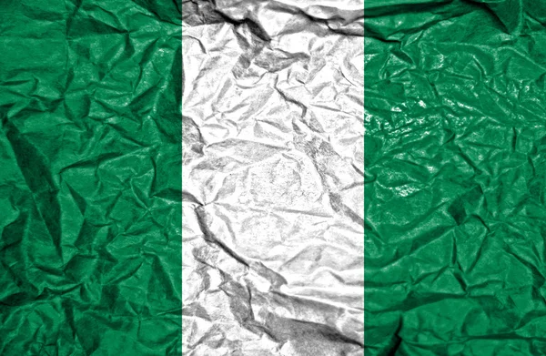 Nigeria Vintage Flagge auf alten zerknitterten Papierhintergrund — Stockfoto