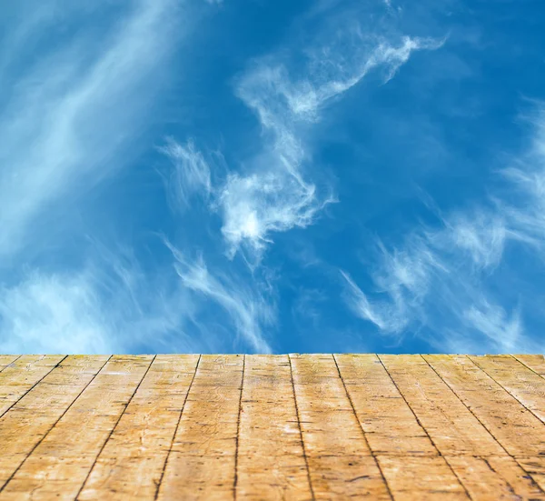 Clear blue sky and wooden floor — Stock Photo, Image