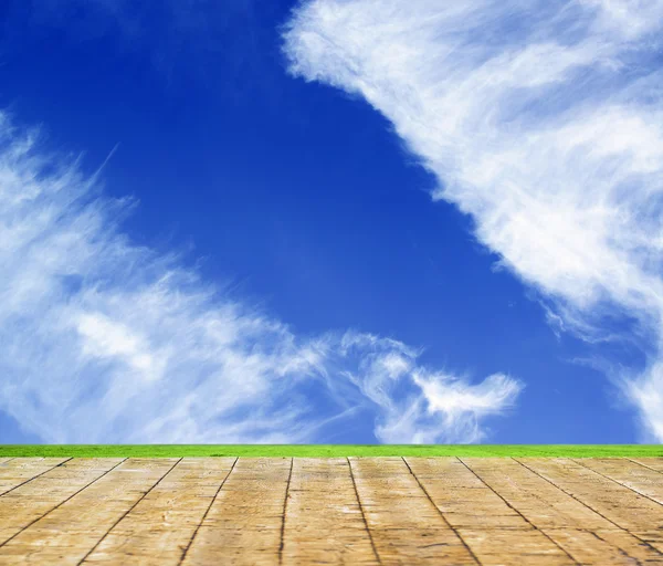 Background with empty wooden table over beautiful meadow — Stock Photo, Image