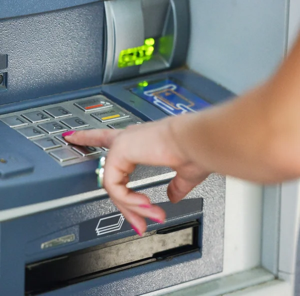 Close-up of hand entering PIN/pass code on ATM/bank machine keyp — Stock Photo, Image