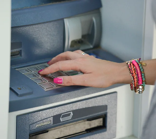 Close-up of hand entering PIN/pass code on ATM/bank machine keyp — Stock Photo, Image