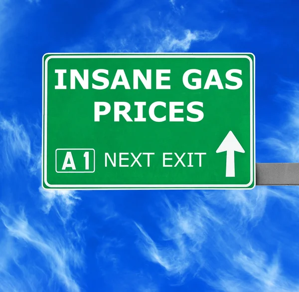 INSANE GAS PRICES road sign against clear blue sky — Stock Photo, Image