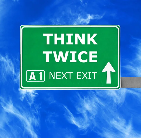 THINK TWICE road sign against clear blue sky — Stock Photo, Image