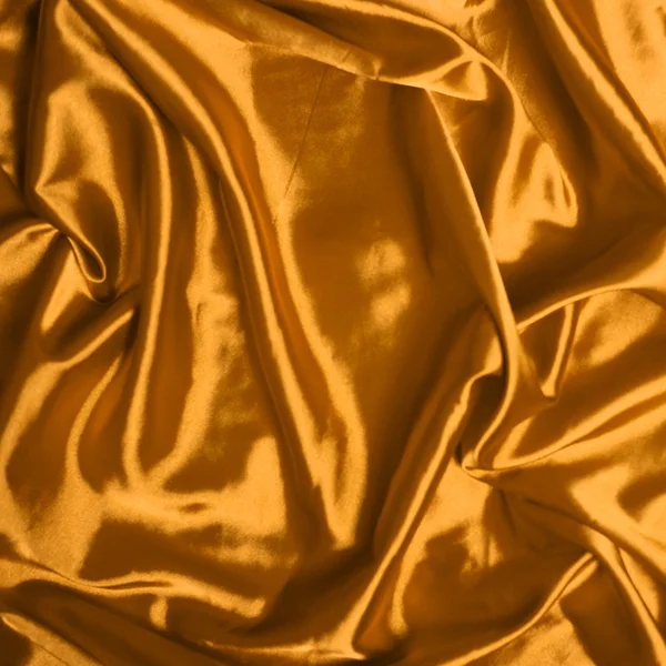 滑らかなエレガントなゴールド シルク背景 — ストック写真