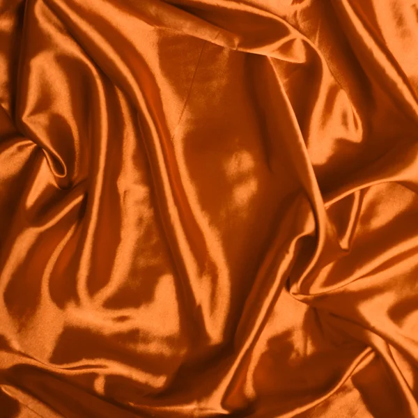 Gładkie elegancki pomarańczowym tle jedwab — Zdjęcie stockowe