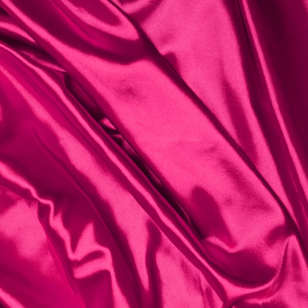 Soepele elegante roze zijde achtergrond — Stockfoto