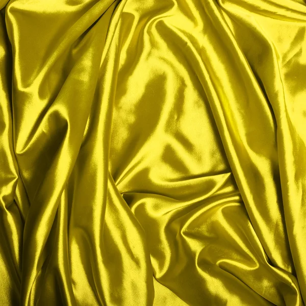 Gładkie elegancki żółtym tle jedwab — Zdjęcie stockowe
