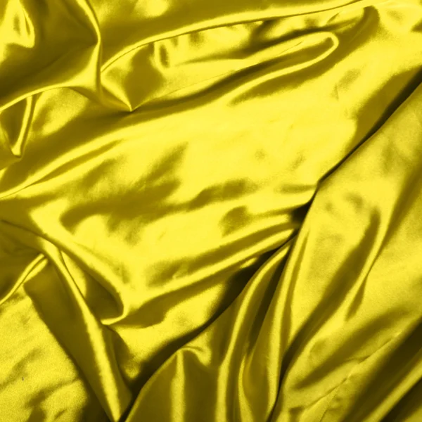 Liso elegante fundo de seda amarela — Fotografia de Stock