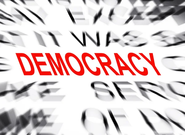 Blured tekst z naciskiem na rzecz demokracji — Zdjęcie stockowe