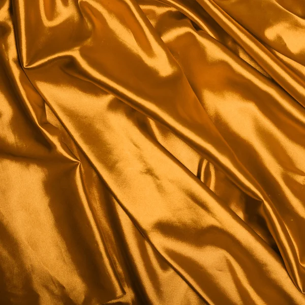 Smooth elegant gold silk background Stock Image