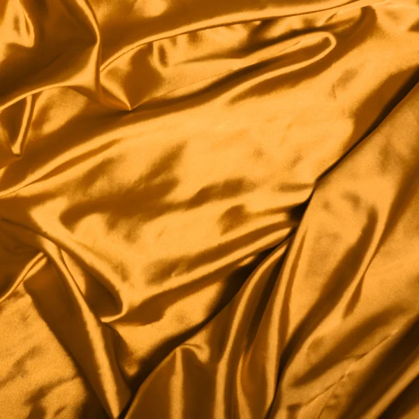 Smooth elegant gold silk background Stock Photo
