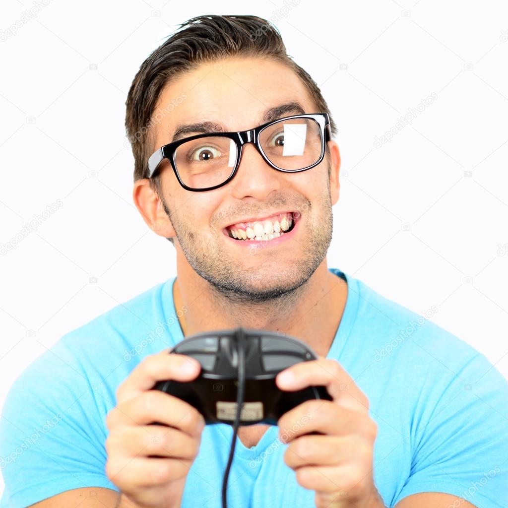 Portrait of handsome man holding joystick for video games agains