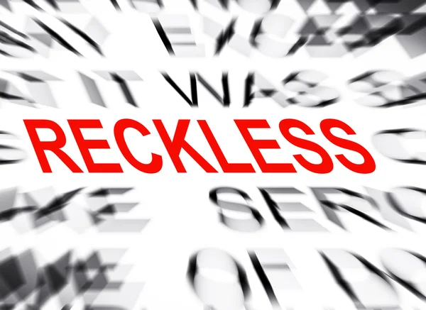 Texto desenfocado con enfoque en RECKLESS — Foto de Stock