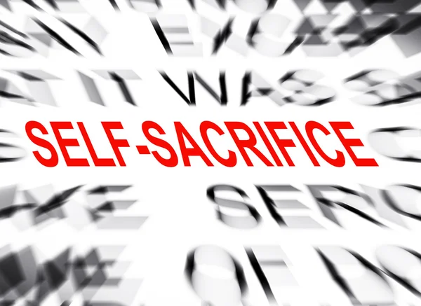 Blured tekst met focus op zelfopoffering — Stockfoto
