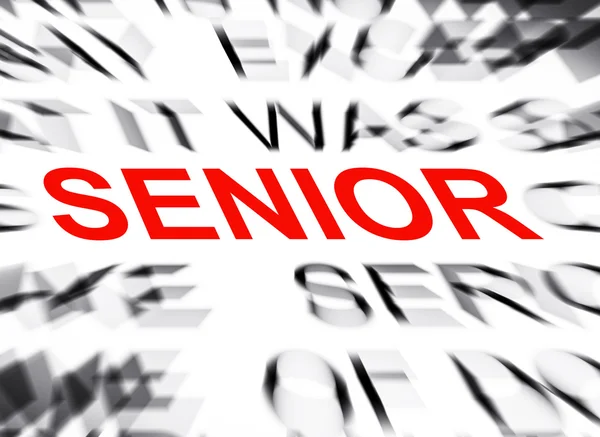 Blured text with focus on SENIOR — Stock Photo, Image