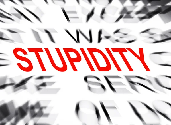 Blured text with focus on STUPIDITY — Stock Photo, Image