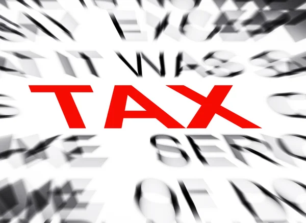 Blured tekst met focus op belasting — Stockfoto