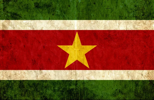 Grungy papier vlag van Suriname — Stockfoto