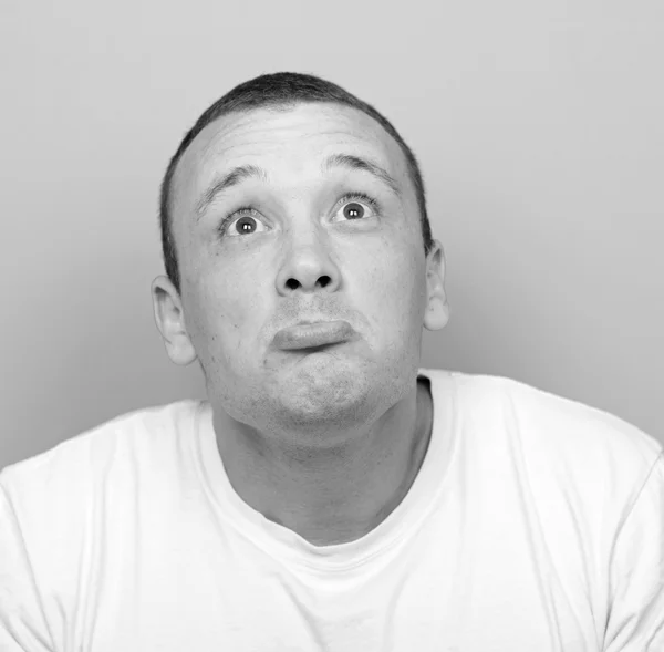 Portrait of desperate man against green background — Stock Photo, Image