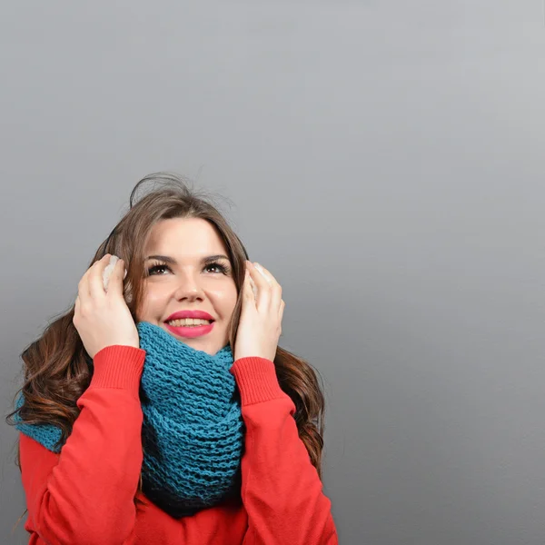 Portrait of young thoughtful woman in winter clothes looking up — Stock Photo, Image