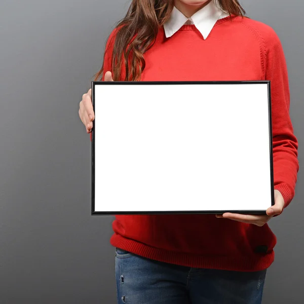 Woman holding empty frame with space for your advertisement agai — Stock Photo, Image