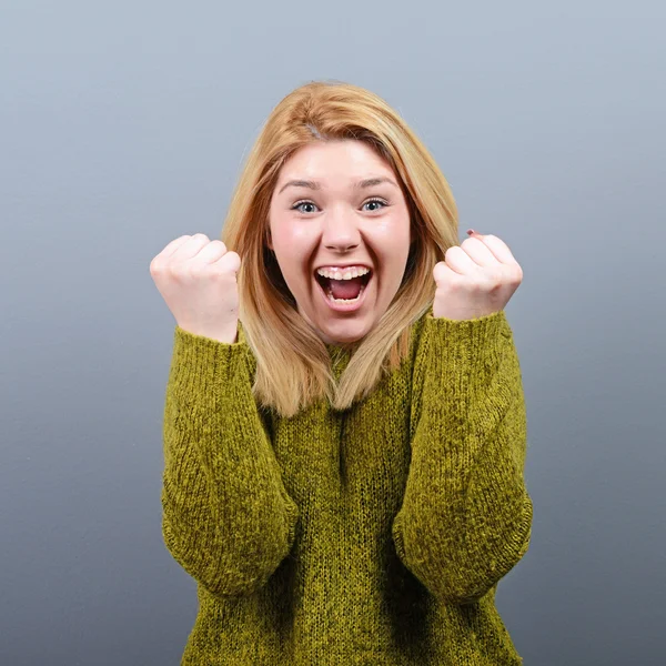 Portrait of happy woman exults pumping fists ecstatic celebrates — Stock Photo, Image