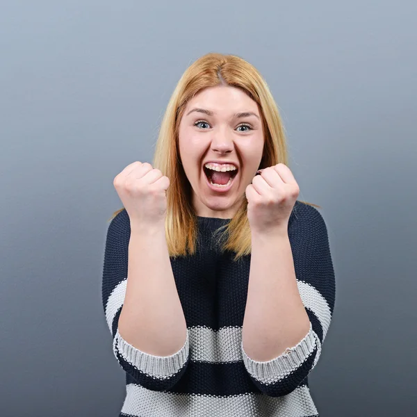 Portrait of happy woman exults pumping fists ecstatic celebrates — Stock Photo, Image