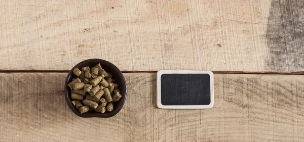 Green plant hops on old wood table — Stock Photo, Image