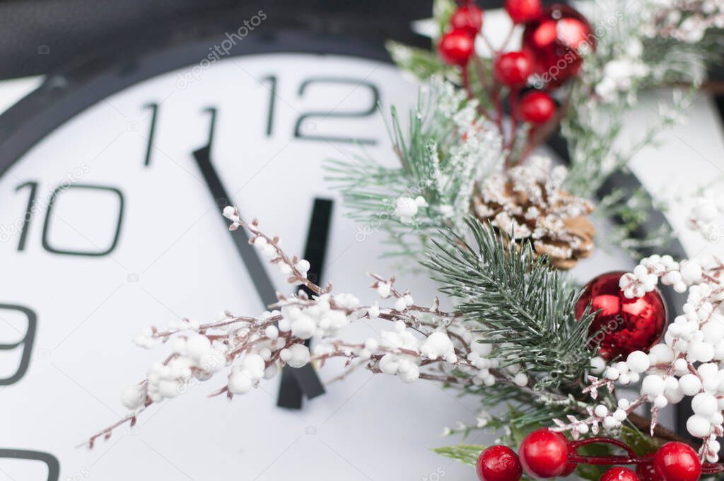 Christmas decoration with red ball. Time shows 12 o'clock, New Year and Christmas 2021