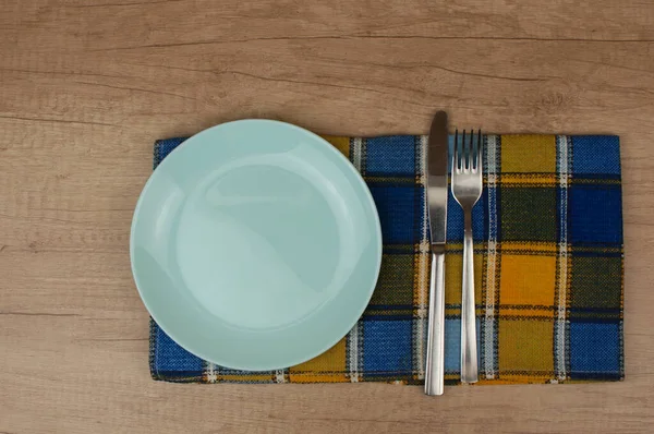 Empty White Plate Fork Knife Colorful Napkin Wooden Table Top — Stock Photo, Image