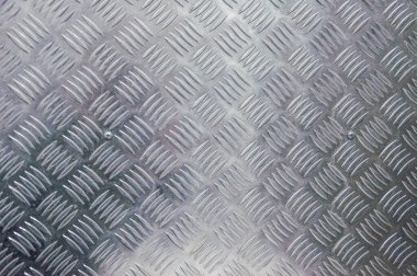 Gümüş rengi metal elmas plaka arka planı.