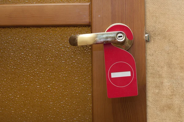 Παράκληση να μην ενοχλήσει σε μια πόρτα του ξενοδοχείου αριθμός — Φωτογραφία Αρχείου